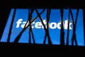 Logo of the Facebook. Red censored text blurred on background. The concept of censorship on popular social networks. Royalty Free Stock Photo