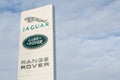 Logo of famous automotive companies Jaguar, Land Rover and Range Rover, on blue sky background