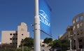 Logo flag of California State University San Marcos (CSUSM) with academic buildings