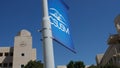 Logo flag of California State University San Marcos (CSUSM) with academic buildings