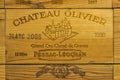 Logo of French winery Chateau Olivier on wooden wine box. Royalty Free Stock Photo