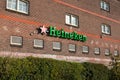 Logo of Heineken, the famous Dutch beer on a traditional brick wall in Amsterdam, Nl Royalty Free Stock Photo