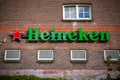 Logo of Heineken, the famous Dutch beer on a traditional brick wall in Amsterdam, Nl Royalty Free Stock Photo