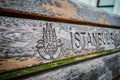 Logo Istanbul on wooden chairs