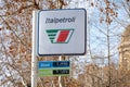 The logo of the Italpetroli gas station on a small white banner with the prices for diesel and senza PB petrol fuel