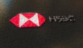 Plastic toy blocks compose logo of HSBC, editorial conceptual 3d rendering