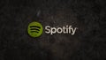 Logo of music streaming app Spotify crashing down into dust on earth ground