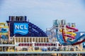 Logo of Norwegian Cruise Line on top of cruise ship