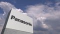 Logo of PANASONIC on a stand against cloudy sky, editorial 3D rendering