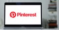 Logo of Pinterest, a social media and image-sharing website, is displayed on a laptop screen.