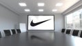 Nike inscription and logo on the screen in a meeting room. Editorial 3D rendering