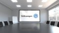 Volkswagen logo on the screen in a meeting room. Editorial 3D rendering Royalty Free Stock Photo