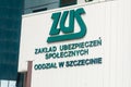 Logo and sign ZUS Polish: Zaklad Ubezpieczen Spolecznych on the office in Szczecin. ZUS is Polish Social Insurance Institution.