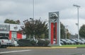 Logo and Signage of a Nissan Car and SUV Dealership. Royalty Free Stock Photo