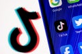 The logo of the social network TikTok behind bars. The concept of TikTok censorship and prohibition