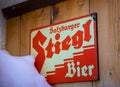 Logo of Stiegl beer in front of a local bar in Austria. Made in Salzburg. Royalty Free Stock Photo