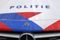 Logo and striping in front of dutch police (politie) car