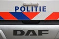 Logo and striping in front of dutch police (politie) car