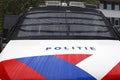 Logo and striping in front of dutch police (politie) special forces car with window protection