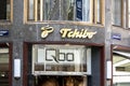 The logo of Tchibo company above the entrance to their store Qbo which sells world-known coffee