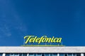 Logo of Telefonica against a intense blue sky