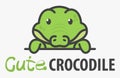 Logo template with cute curious little crocodile. Vector logo design croc template for zoo, veterinary clinics, etc. Cartoon