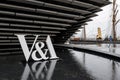 The logo of V and A Art Design Museum in Dundee, Scotland with a water pool in front of it