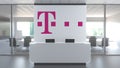 Logo of DEUTSCHE TELEKOM AG on a wall in the modern office, editorial conceptual 3D rendering