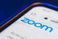 Logo zoom app on the screen smartphone closeup