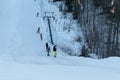 Logoisk. Belarus. 01.13.2023. A group of happy teenage snowboarders in special equipment