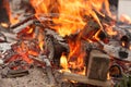 Logs and branches burning in a wood fire