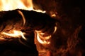 Logs burning with flames in a fireplace Royalty Free Stock Photo