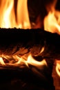 Logs burning with flames in a fireplace Royalty Free Stock Photo