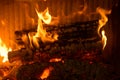 Logs burning in the hearth of a fireplace Royalty Free Stock Photo