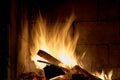 Logs are burning in rare vintage fireplace. Royalty Free Stock Photo