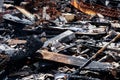 Logs from a burnt house, place after a fire Royalty Free Stock Photo