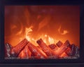 The logs of the fireplace burn with a bright fire. Artificial decorative fireplace with imitation of fire. Modern home Royalty Free Stock Photo