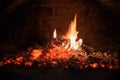 Logs of firewood burn out in the oven. Coals and flames in the fireplace Royalty Free Stock Photo