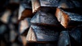 Logs that have been chopped and prepared for winter are piled randomly, with a close-up side view on display Royalty Free Stock Photo