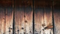 Logs from which to build a frame. Pieces of logs near the wall of a wooden house.