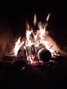 Logs of wood burning in the home fireplace. Royalty Free Stock Photo
