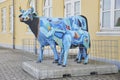 logstor, Denmark, July, 2022: multi-colored statue of cow with calf