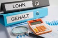 Lohn, Gehalt. Binder data finance report business with graph analysis in office