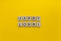 Lohri, minimalistic banner with the inscription in wooden letters Royalty Free Stock Photo