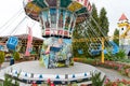 Loifling, Germany - 26 July, 2018: Merry-go-round swings for children. Little girl have fun in Churpfalzpark Loifling amusement