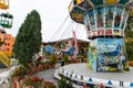 Loifling, Germany - 26 July, 2018: Merry-go-round swings for children. Little girl have fun in Churpfalzpark Loifling amusement