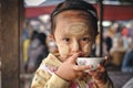 Loikaw, Myanmar - May 25, 2016: Portrait of little girl in Myanmar with Tanaka on the cheeks