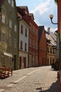 The street of medieval Loket city with colorful buildings and cobblestone road by summer day