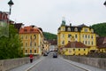 Loket, Czech Republic; 5/20/2019: Colorful buildings at the background from the arch bridge in Loket
