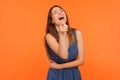 Lol, hey you! Excited joyful brunette woman laughing out loud, holding her belly and pointing finger to camera Royalty Free Stock Photo